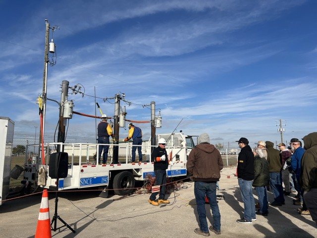 Pike Electric personnel provide a high voltage demonstration and explain to Garrison and Directorate of Emergency Services attendees how to safely respond to different types of incidents. (U.S. Army photo by Christine Luciano, DPW Environmental)