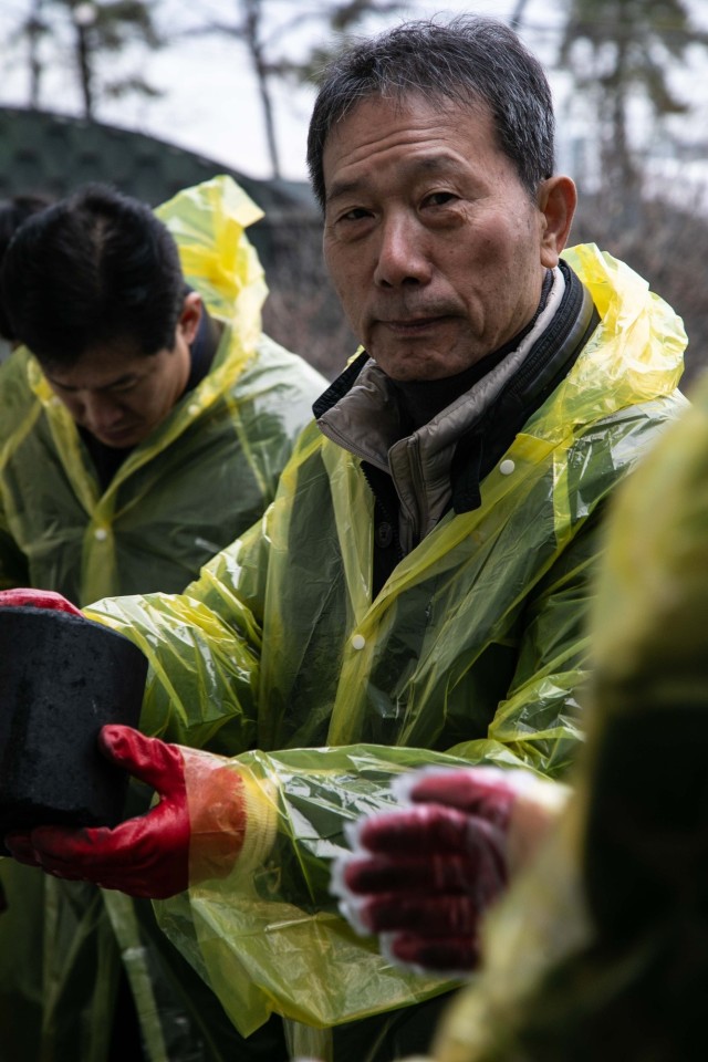 Camp Casey U.S. Soldiers deliver coal briquettes to underprivileged neighborhoods in the city of Uijeongbu