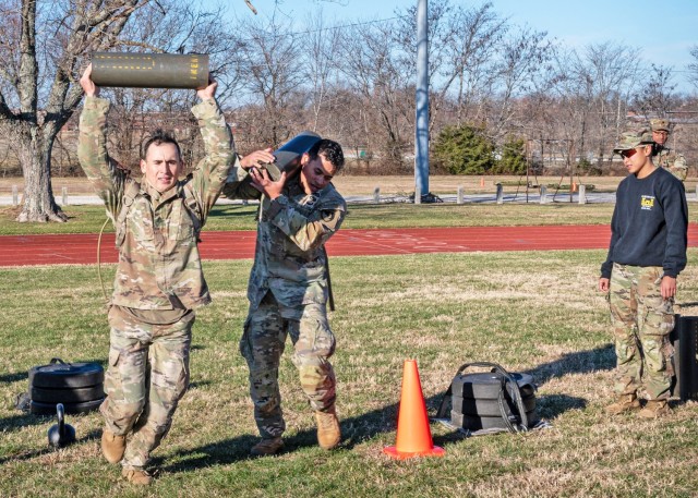 Rugged Best Sapper competitors, Staff Sgt. Brandon Burnett (left) and Sgt. 1st Class Rafael Agosto, with the 20th Engineer Battalion, at Fort Cavasos, Texas, compete in the sprint, drag, carry portion of the x-mile run event Dec. 7 at Gerlach...