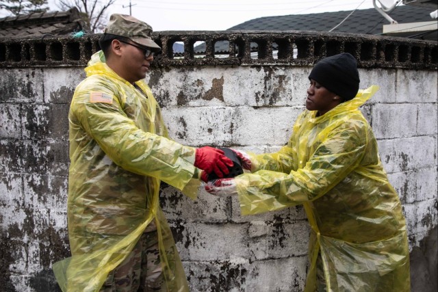 Camp Casey U.S. Soldiers deliver coal briquettes to underprivileged neighborhoods in the city of Uijeongbu