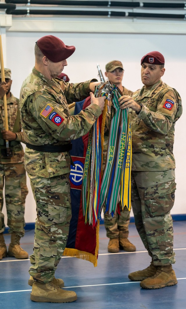 Maj. Gen. Pat Work, commander of the 82nd Airborne Division, "Task Force 82", and Command Sgt. Maj. Randolph Delapena, senior enlisted advisor for 82nd Airborne Division, uncase their division colors during the transfer of authority ceremony, between 10th Mountain Division, "Task Force Mountain", to 82nd Airborne Division, "Task Force 82", hosted by the U.S. Army’s V Corps, at Mihail Kogalniceanu Air Base, Romania, Dec. 15.  The soldiers and paratroopers assigned to TF 82 support the U.S. Army V Corps’ mission to reinforce NATO’s eastern flank, assure European allies and partners, and deter aggression. (U.S. Army Photo by Sgt. 1st Class Jonathan Hornby)