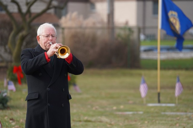 A bugler plays &#34;Taps&#34; at the conclusion of the ceremony.