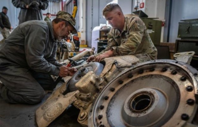 A Soldier assigned to 1st Armor Brigade, 3rd Infantry Division works with an Armed Forces of Ukraine soldier during M109 Self-Propelled Howitzer maintenance training at Grafenwoehr Training Area, Germany, May 25, 2022. The course is provided by the U.S. and Norway as part of their respective security assistance packages. 

