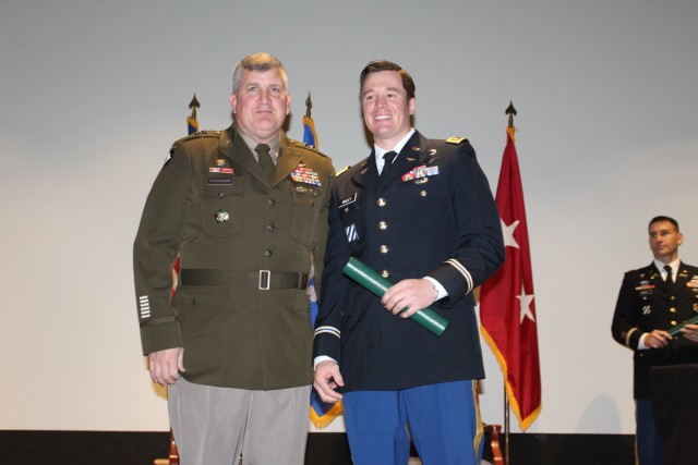 Commencement speaker Maj. Gen. Tom O’Connor, commander of the Aviation and Missile Command, congratulates Maj. Jaryd Bailey, distinguished honor graduate Friday at Heiser Hall. 

