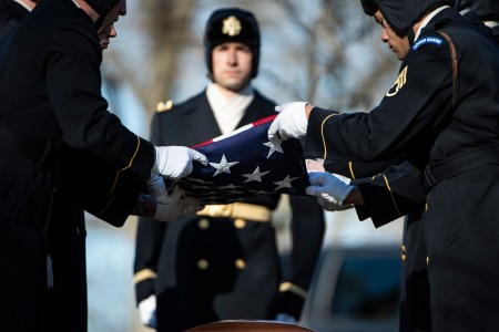 Soldiers assigned to the 3rd U.S. Infantry Regiment, known as “The Old Guard,” and the U.S. Army Band, “Pershing’s Own,&#34; conduct military funeral honors with funeral escort for Army Cpl. Gordon D. McCarthy at Arlington National Cemetery, Arlington, Va., Dec. 14, 2023. McCarthy’s unit was attacked by enemy forces near the Chosin Reservoir, North Korea. After the battle, McCarthy&#39;s remains were not recovered and he was reported missing in action. He was officially accounted for on Feb. 13, 2023. His niece, Marilyn Stanton, received the U.S. flag from McCarthy’s funeral service.