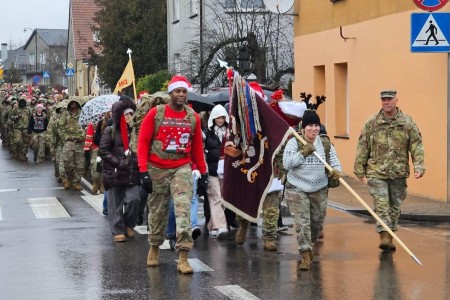 Soldiers of the 47th Brigade Support Battalion, 2nd Armored Brigade Combat Team, 1st Armored Division take part in the annual &#34;Pioneer Rush&#34; ruck march, Dec. 19, 2023. This year&#39;s iteration saw Soldiers delivering gifts to children in Drawsko Pomorskie, Poland.