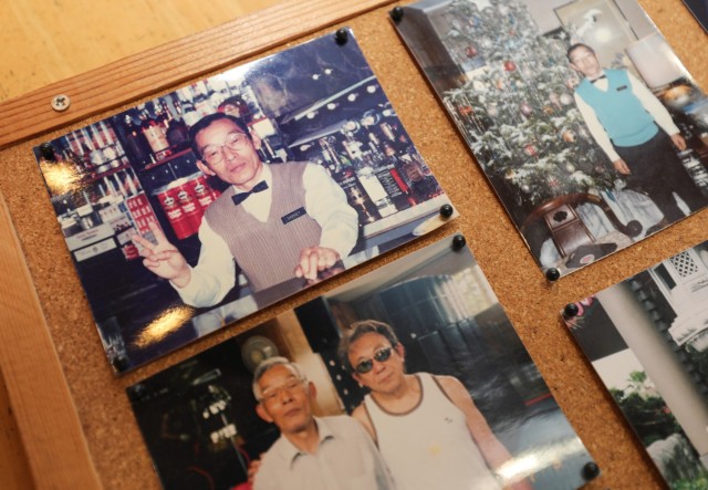 A collection of Tsuneo Yamagishi&#39;s photos can be seen in a photo album during a visit to his home in Sagamihara, Japan, Dec.  5, 2023. Yamagishi, who previously served in the Japanese Imperial Navy, eventually worked more than 50 years at U.S. Army installations following World War II. 
