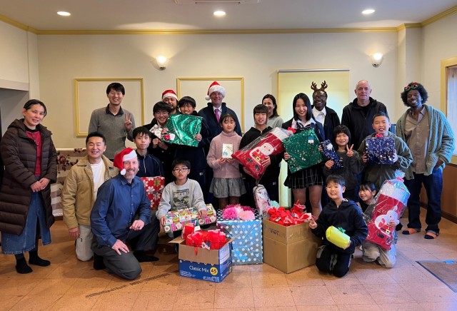 Logistics Readiness Center-Honshu employees donate several gifts to children at the Seikou Gakuen children’s home in Zama, Japan, Dec. 22, 2023.