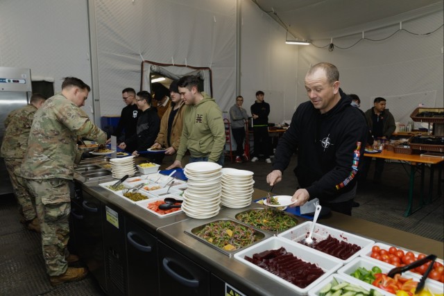 3rd Infantry Division Artillery Soldiers enjoy a Christmas meal in Latvia