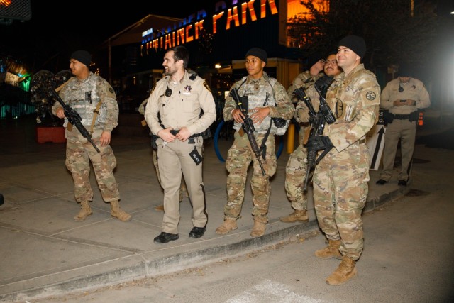 Soldiers from the 1st Squadron, 221st Cavalry works with local law enforcement in downtown Las Vegas, Nevada, Dec. 31, 2023. The soldiers worked closely with local law enforcement to bolster security during the New Year&#39;s Eve celebrations. 