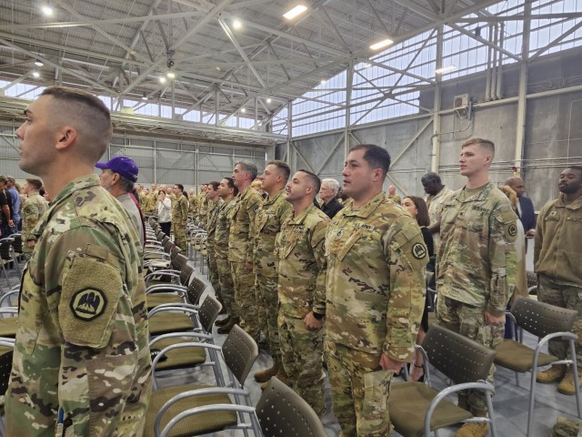 Soldiers of the 1-244th Assault Helicopter Battalion sing the Army Song during a deployment ceremony at the Army Aviation Support Facility #1 in Hammond, Louisiana, Dec. 2, 2023. Over 70 Soldiers will deploy to Kosovo to support a NATO-led peacekeeping mission. (U.S. Army National Guard photo by Spc. Quinlin Creech) 