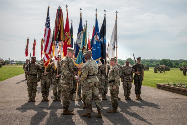Incoming Maneuver Support Center of Excellence and U.S. Army Fort Leonard Wood Commanding General Maj. Gen. Christopher Beck (left) takes the colors from Lt. Gen. Milford Beagle Jr., U.S. Army Combined Arms Center commanding general, during a...