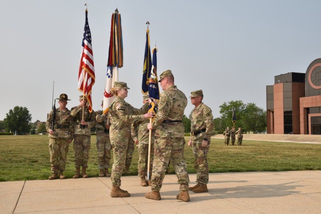 Incoming U.S. Army Chemical, Biological, Radiological and Nuclear School Commandant Col. W. Bochat takes the colors from Maj. Gen. Christopher Beck, commanding general of the Maneuver Support Center of Excellence and Fort Leonard Wood, during a change-of-commandant ceremony June 6 on the MSCoE Plaza. 