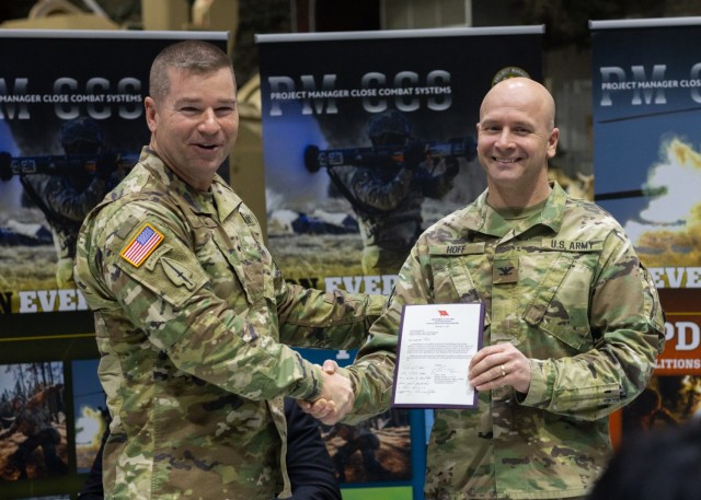 Brig. Gen. John T. Reim (left), Joint Program Executive Officer Armaments & Ammunition, and Col. Russell Hoff (right), Project Manager Close Combat Systems (PM CCS).