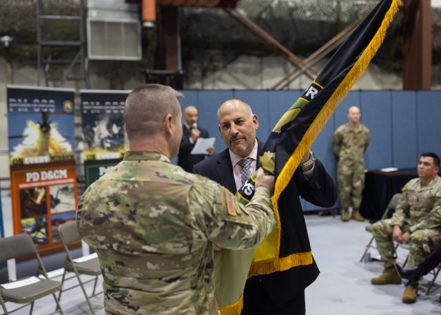 Brig. Gen. John T. Reim (left), Joint Program Executive Officer Armaments & Ammunition, and Joseph Pelino (right), Acting Project Manager Close Combat Systems (PM CCS).