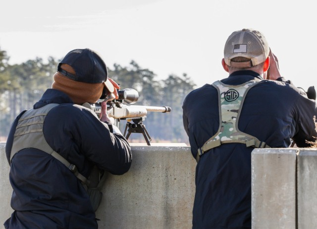 Spc. Dustin Carr and Staff Sgt. Jacob Blackburn, both shooter and instructors assigned to the U.S. Army Marksmanship Unit&#39;s service rifle team, identify and engage targets at the Mammoth Sniper Challenge at Fort Eisenhower, GA Jan. 5, 2023.The...