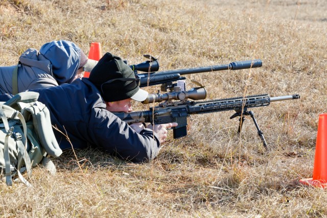 Sgt. 1st Class Brandon Green and Sgt. Forrest Greenwood, both shooter and instructors assigned to the U.S. Army Marksmanship Unit&#39;s service rifle team, identify and engage targets at the Mammoth Sniper Challenge at Fort Eisenhower, GA Jan. 5,...