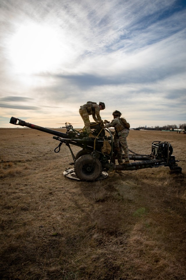 Artillery Soldiers from Bravo Battery, 3rd Battalion, 320th Field Artillery Regiment, 3rd Brigade Combat Team, 101st Airborne Division conduct sling-load operations and elevator drills with 3rd Attack Helicopter Battalion, 1st Aviation Regiment,...
