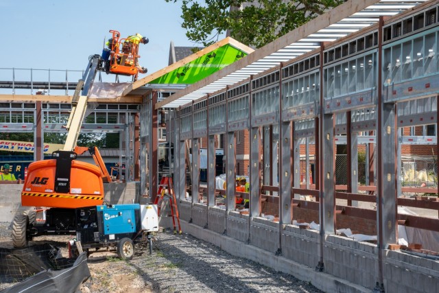 Now that walkways 1-4 have foundations, framing and trusses installed, the next step is to add block and slab pours as well as roofing.