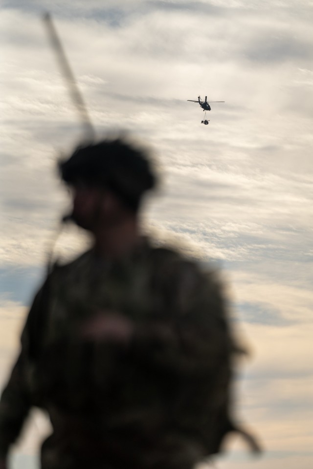 Spc. Dawson Webster Radio Telephone Operator (RTO) for Bravo Battery, 3rd Battalion, 320th Field Artillery Regiment, 3rd Brigade Combat Team, 101st Airborne Division, "Task Force 82", monitors his radio during elevator drills on Mihail...