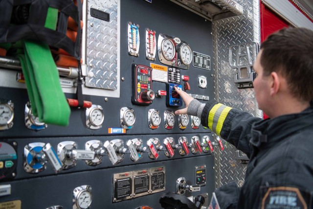 Firefighter Brandon Staley, Letterkenny Army Depot, points out the foam-level indicator on one of the three engines transitioned to the updated military specifications for land and maritime firefighting agent, fluorine-free foam at Letterkenny...