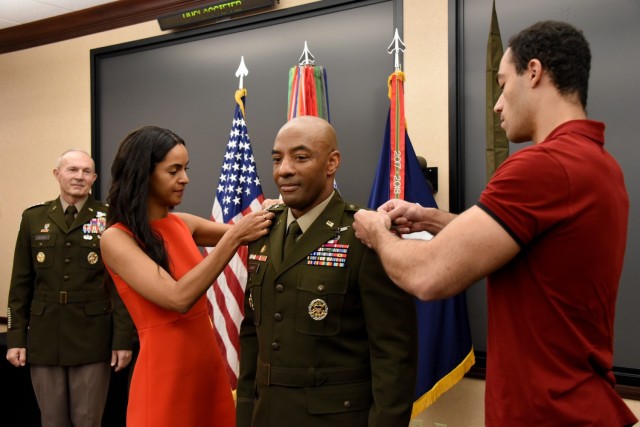 Lt. Gen. Sean A. Gainey receives his third star from his children, Tatjana and Justin, during a promotion ceremony at the U.S. Army Space and Missile Defense Command’s Redstone Arsenal, Alabama, headq