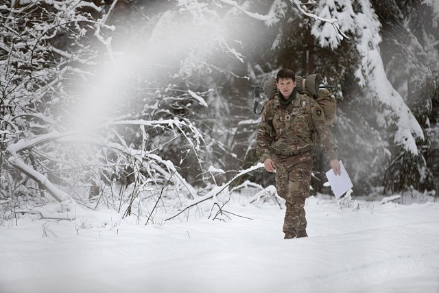 U.S. Army Spc. Zachary C. Smith, an assistant gunner with Headquarters and Headquarters “Hazard” Company, 2nd Battalion, 69th Armored Regiment “Panther Battalion,” 2nd Armored Brigade Combat Team, 3rd Infantry Division, trudges through the snow during the land navigation portion of the Croatian “Winter Challenge” at Bemowo Piskie Training Area, Poland, Jan. 5, 2024. The Croatian “Winter Challenge” had four different countries competing: the 3rd Infantry Division representing the U.S., the 12th Croatian Contingent “Iron Boars” representing Croatia, the Romanian Air Defense “Transylvanian Gepards” representing Romania, and the 15th Mechanized Brigade representing Poland. The 3rd Infantry Division’s mission in Europe is to engage in multinational training and exercises across the continent, working alongside NATO Allies and regional security partners to provide combat-credible forces to V Corps, America’s forward deployed corps in Europe. 
 (U.S. Army photo by Dan Yarnall)