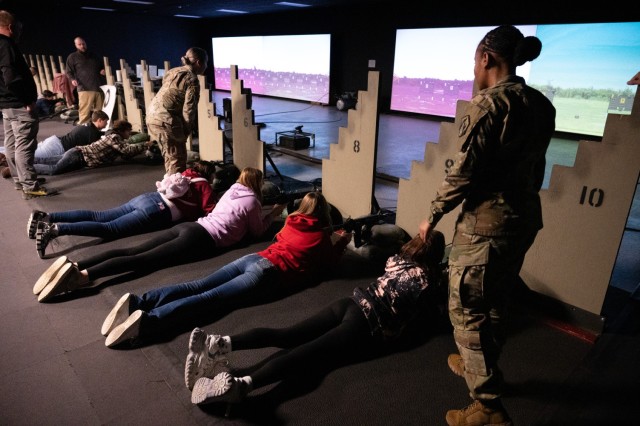 Summersville High School students practice shooting targets on the M4 rifle Engagement Skills Trainer located in Building 729 during their field trip to Fort Leonard Wood on Jan. 8.