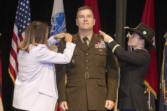 Wife, daughter pin two-star rank on Picatinny commanding general during promotion ceremony 