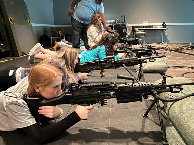 New Brockton High School student Megan Tindol shoots a simulated weapon the Engagement Skills Trainer at Fort Novosel on Jan. 10, 2024.