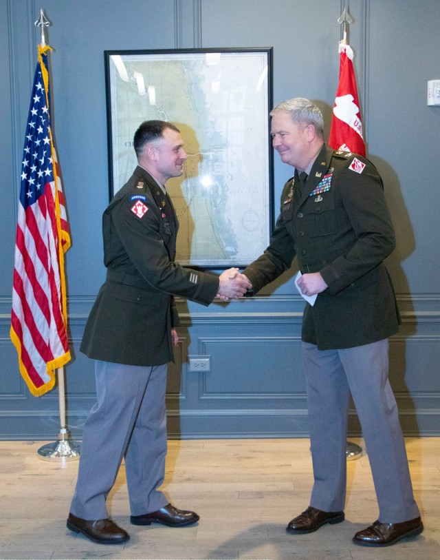 USACE Chicago Deputy Commander shakes hands with the District Commander COL Rockwell during promotion ceremony
