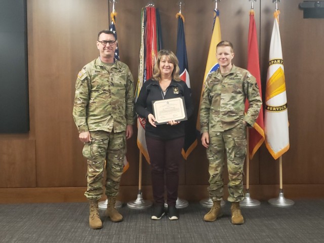 (From left) USASAC&#39;s Command Sgt. Maj. Stephen Burnley, Melody Mansker, and Brig. Gen. Brad Nicholson