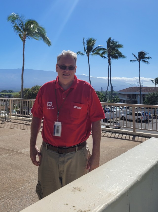 Bill Proctor, Hydrologic Engineering and Power Branch chief at Northwestern Division, U.S. Army Corps of Engineers (USACE), takes a break while at a collection location for Rights of Entry (ROE) forms in Maui, Hawaii. USACE staff need ROE forms to access private property for their debris removal mission. Proctor helped wildfire survivors with questions regarding the forms during his deployment in December 2023. This photo has been altered for secruity purposes.