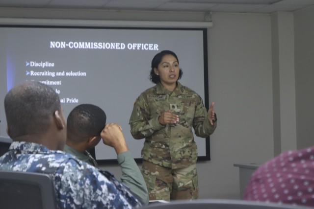 Sgt. Maj. Esmeralda Vaquerano, G-1 (personnel) Sergeant Major for the D.C. Army National Guard recites the U.S. Army’s NCO Creed to members of the Jamaica Defence Force (JDF) during a State Partnership Program visit to the Caribbean Military...