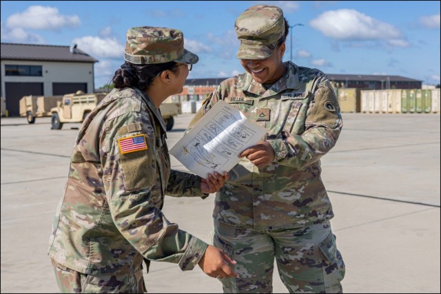 1st Theater Sustainment Command Soldiers reviewing paperwork