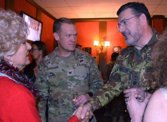 From left to right: Francesca Gheller-Dorrity, a local survivor spouse and mother, Col. Scott Horrigan, USAG-Italy commander, and Italian Base Commander Col. Michele Amendolagine, attend the annual survivor&#39;s holiday party Dec. 13, 2023.