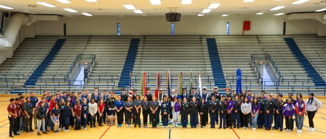 The Joint Armed Forces Color Guard, along with Soldiers from the United States Army Band “Pershing’s Own”, pose for a picture with Houston-area Junior Reserve Officers&#39; Training Corps students.
