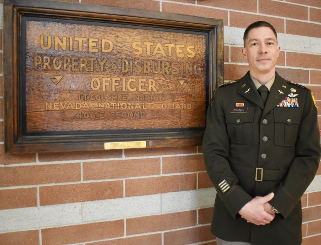 Lt. Col. Andrew Wagner, a longtime Army aviator, on Jan. 19, 2024, becomes the 10th U.S. property and fiscal officer for Nevada since the conclusion of World War II. He is shown on Jan. 17 next to memorabilia saved from Lt. Col. Michael Norton’s stint as the first USPFO for Nevada following the global conflict.