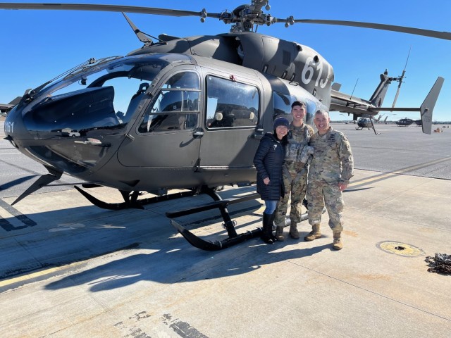 2nd Lt. Jacob M. Corsaro, a flight school student, is joined by his father, Chief Warrant Officer 5 Michael A. Corsaro, chief warrant officer of the Aviation branch, and his mother Suk, on the flightline at Fort Novosel, Ala. (Photo courtesy of...