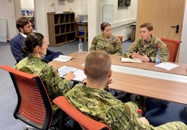 Capt. Chelsea Michta (right), the first person to direct commission into the U.S. Army Military Intelligence Corps, meets with Croatian open-source intelligence partners during a key leader engagement in 2022 at the Army Europe Open Source Center in Wiesbaden, Germany.