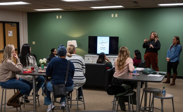 Military spouses Sally Beck (second from right) and Vanessa Arzabala (right) speak on some of the planned initiatives in the works for Fort Leonard Wood’s new Spouse Resource Center during a Jan. 10 soft opening event. The center, located on the...
