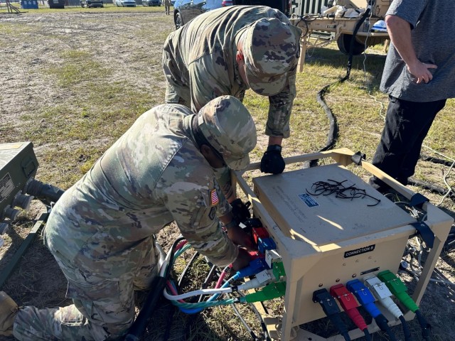 Soldiers from the 14th FH working on the Microgrid System setup and connections during an operational test conducted by the U.S. Army Test and Evaluation Activity at Fort Stewart, Georgia on Nov. 5, 2023.