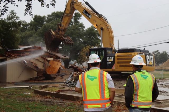 Contractors from Lendlease observe the demolition of old housing in the formerly known as Chaffee Village neighborhood at Fort Cavazos.