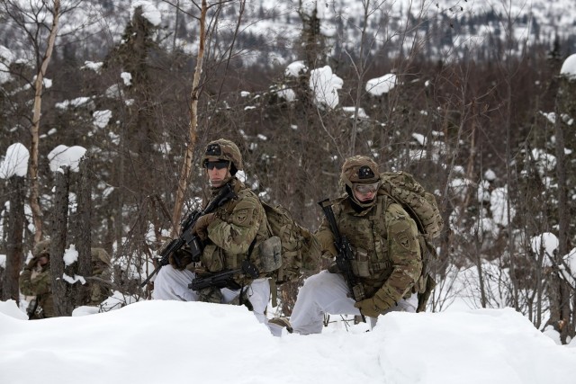 U.S. Army paratroopers assigned to the 3rd Battalion, 509th Parachute Infantry Regiment, 2nd Infantry Brigade Combat Team (Airborne), 11th Airborne Division, “Arctic Angels,” hold security while patrolling to their objective during a combined arms live-fire exercise at the infantry squad battle course on Joint Base Elmendorf-Richardson, Alaska, Feb. 22, 2023. The training was held to prepare for Joint Pacific Multinational Readiness Center 23-02 and focused on large-scale combat operations, including situational training exercises and live fire exercises aimed at improving the paratroopers’ lethality, readiness, and effectiveness in arctic conditions. 