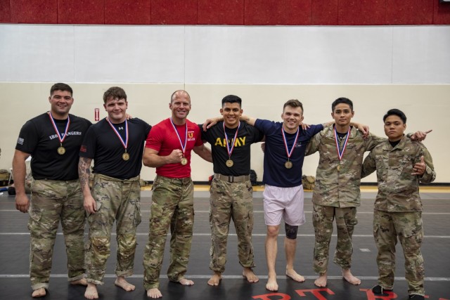 The winners of the Victory Week “Sgt. 1st Class Matthew Leonard” Combatives Tournament pose for a photo after winning their respective weight classes at Long Fitness Center on Fort Riley, Kansas, June 13, 2023. The Soldiers that earned a top 3...