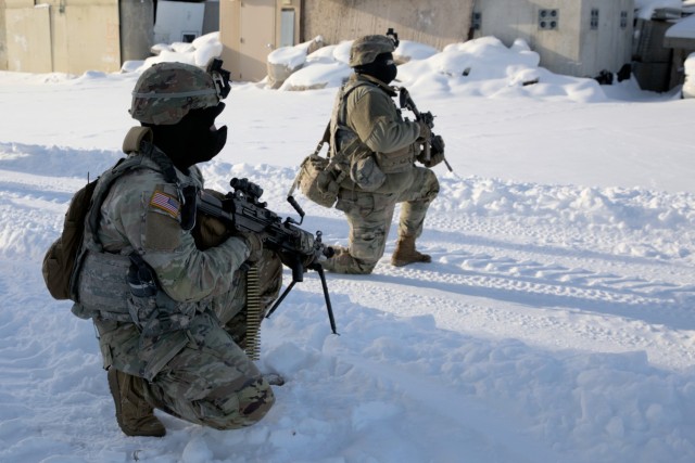 Wisconsin Army National Guard Soldiers with Company A, 2nd Battalion, 127th Infantry Regiment, approach the High Risk Entry Facility Jan. 17 at Volk Field, Wis., during urban warfare training.
(32nd Infantry Brigade Combat Team photo by Staff Sgt. Kati Volkman)