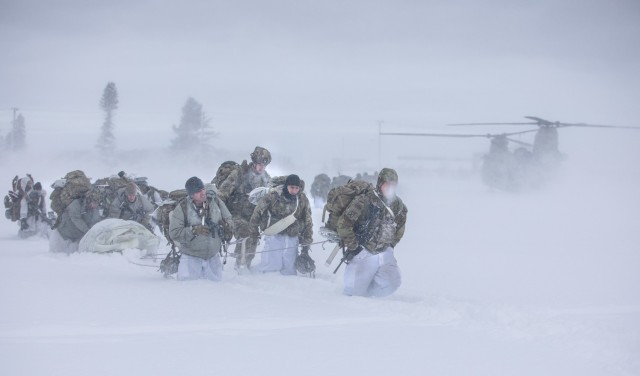 Soldiers across the10th Mountain Division (LI) trek through the snow dragging an Ahkio sled at Division Hill during the D-Series Winter Challenge, Jan. 19, at Fort Drum. Soldiers participating in D-Series had their mental and physical fortitude pushed to the limits by adapting and overcoming challenges such as qualifications for multiple critical weapons systems under simulated stress, and several hands-on tests validating knowledge over essential Alpine survival skills and unit history. (U.S. Army photo by Spc. Salvador Castro.)