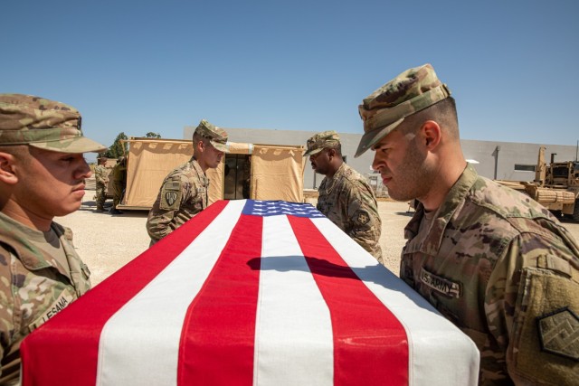 The mortuary affairs team from the 673rd Quartermaster Company demonstrates the ceremonial hand-off of a casket during Juniper Caracal 23-2, at a base in Israel on May 31, 2023.