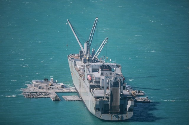 Army mariners assigned to the 368th Seaport Operations Company and 331st Transportation Company construct a causeway adjacent to Merchant Vessel Maj. Bernard F. Fisher off the coast of Bowen, Australia, during Talisman Sabre July 29, 2023. 