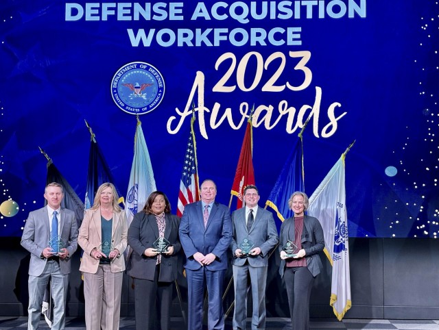 Missile Defense Agency Contract Operations members Jesse Kirstein, Karen Hillstead, Tasha Davis, Director for Contracting John Mayes, Ramin Ghadimi and Teresa Woody accept their 2023 Defense Acquisition Workforce Awards in Fort Belvoir, Va., Jan. 24.


